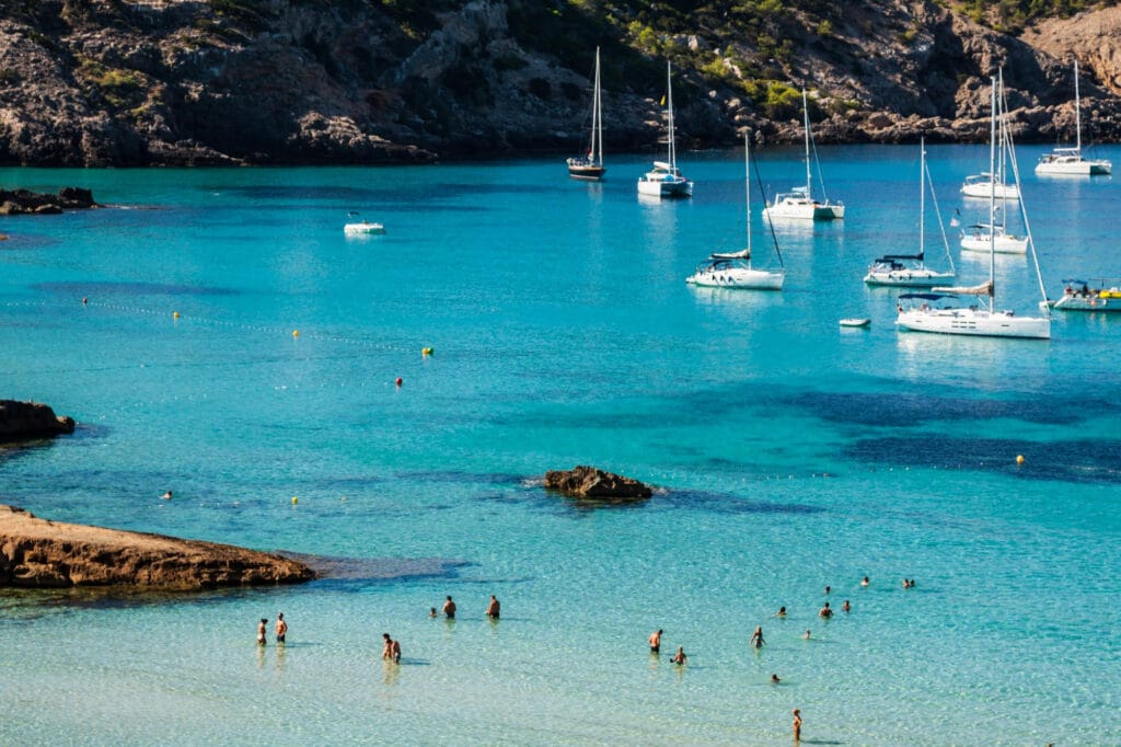 ibiza beach with yachts