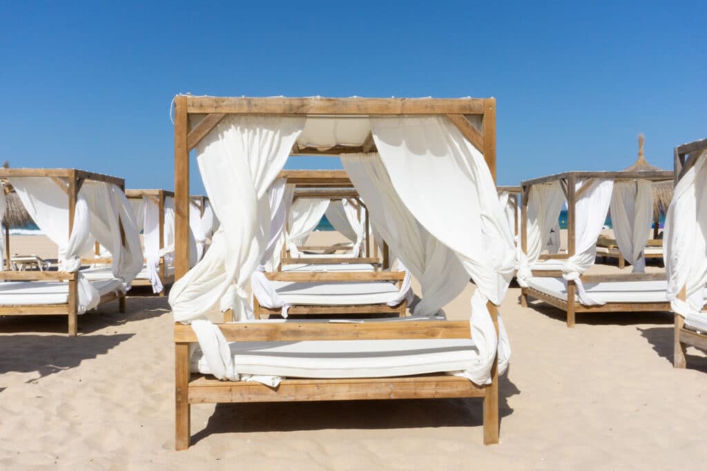 beach club in ibiza with sunbeds