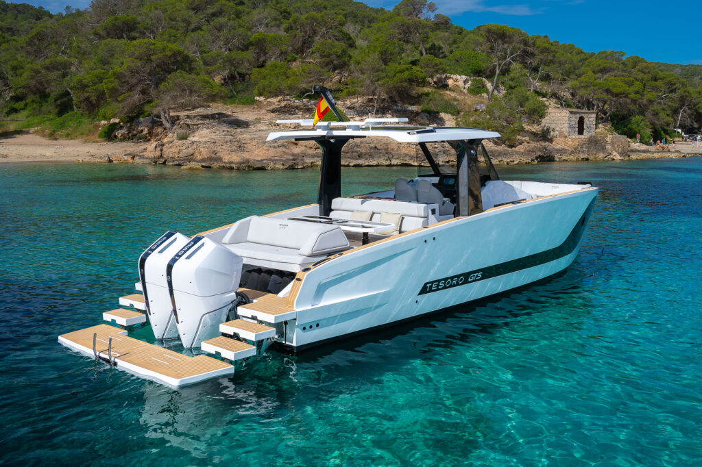 Private yacht anchored over sand in the clear water off Ses Illetes, Formentera